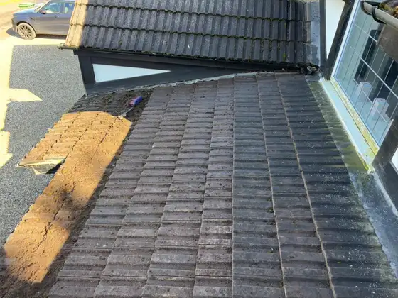 Cleaned tiled roof between two dormer windows