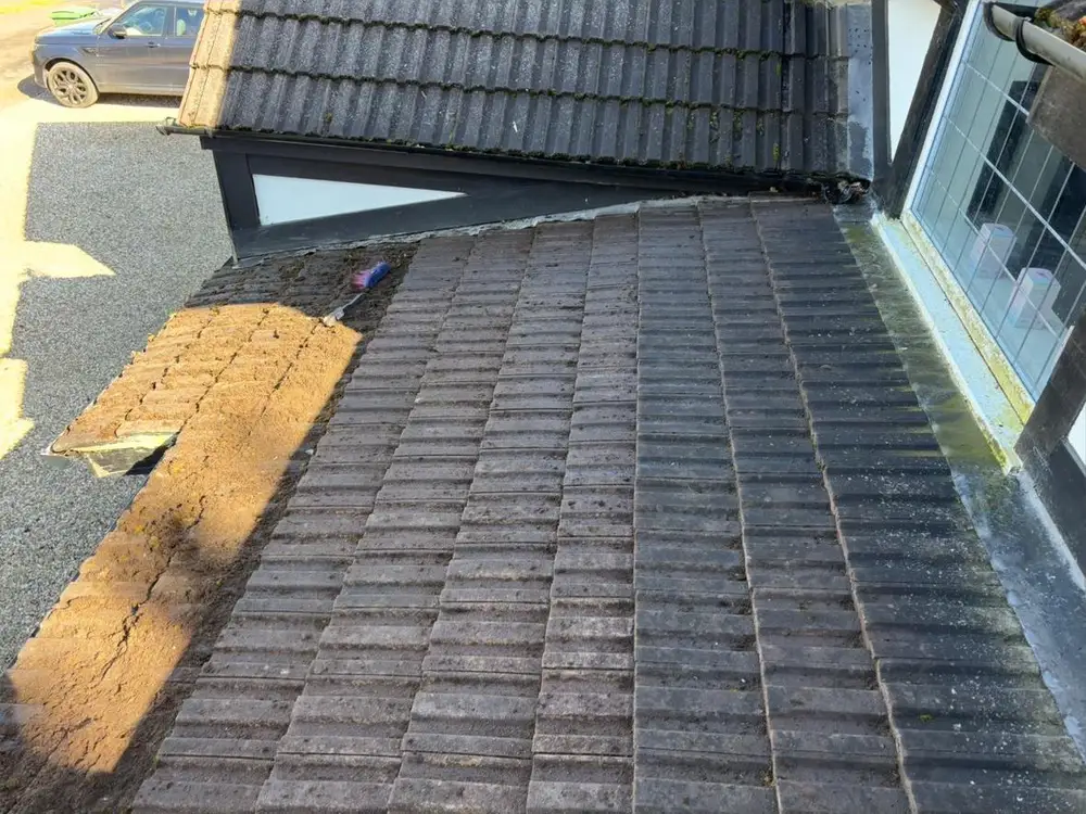 Cleaned tiled roof between two dormer windows