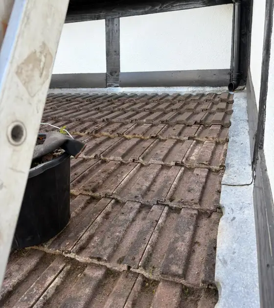 Tiles beside a dormer cheek during roof cleaning