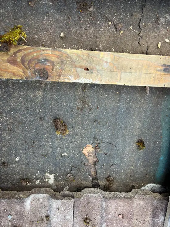Old felt and a new batten during a roof repair