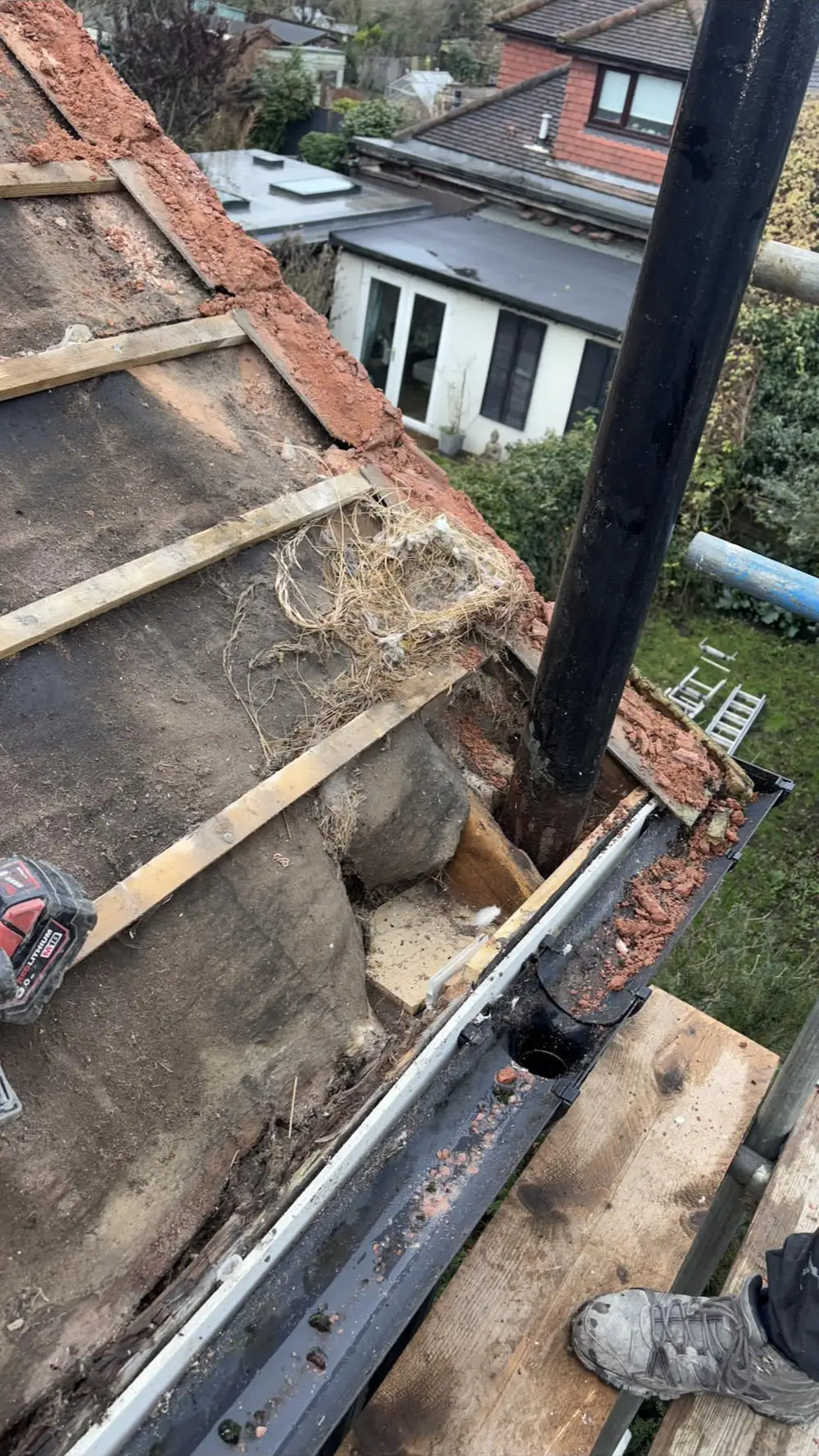 Old roof stripped back to the rafters ready for a new roof