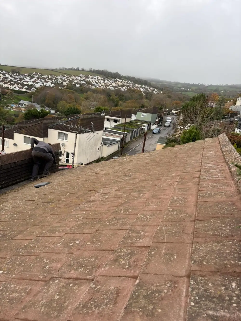 Clean red tiled roof overlooking a Devon hillside