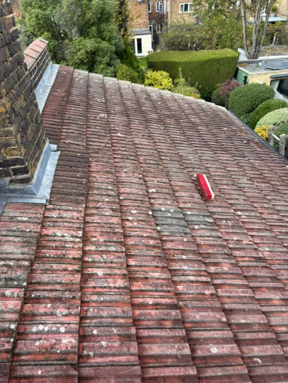 Red clay tiled roof during repair work