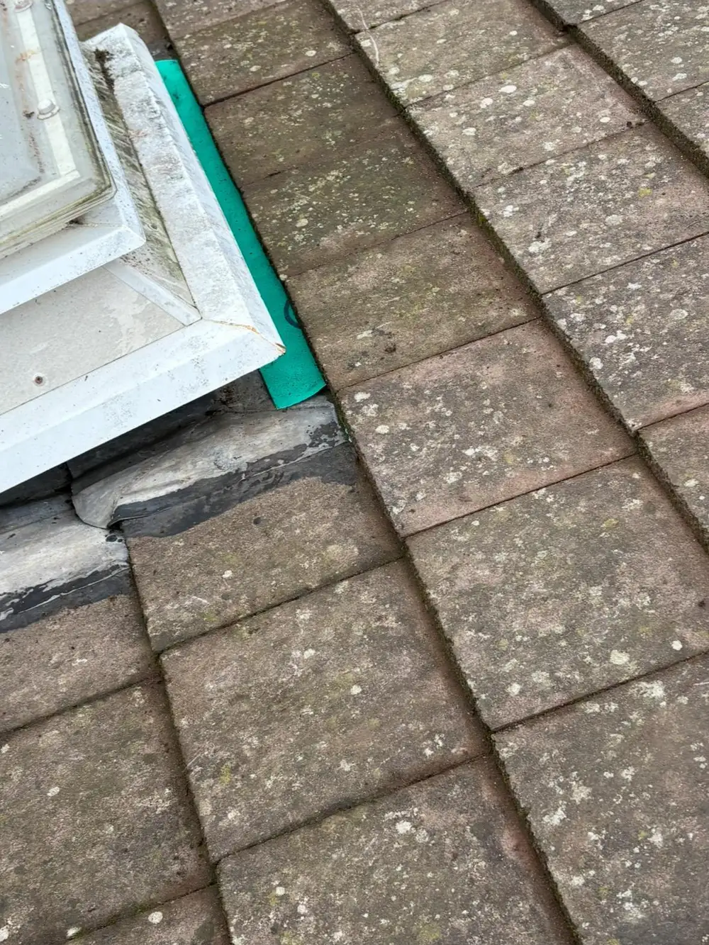 Flashing detail around a roof window on a tiled roof